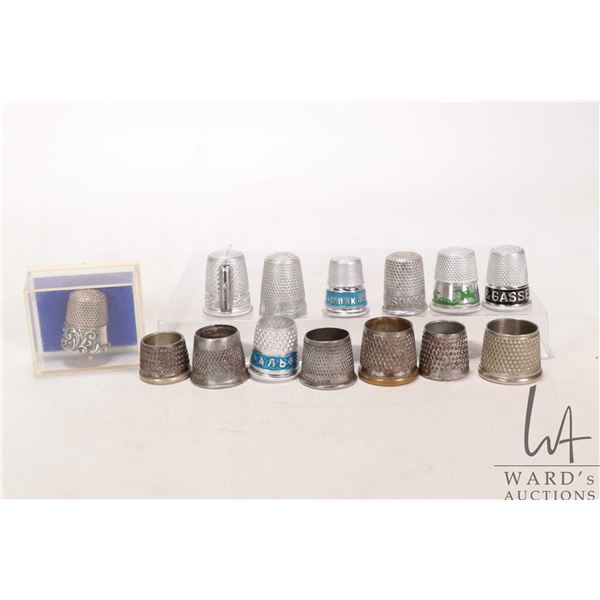 Selection of collectible vintage and modern thimbles including a sterling silver with repousse decor