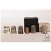 Image 1 : Six collectible thimbles including Inuit carved scrimshaw featuring a dog sled team, two boxed sterl