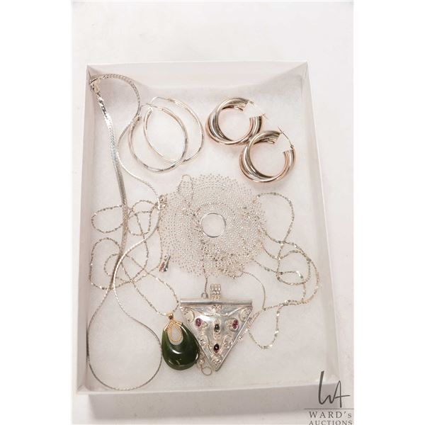 Selection of silver jewellery including earrings, neck chains, pendant set with gemstones etc.