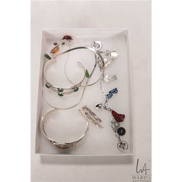 Selection of silver jewellery bracelets, neck chains, earrings etc.
