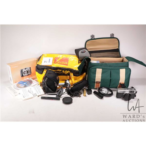 Selection of cameras and supplies including Canon Powershot A710 IS digital camera, Canon Powershot 