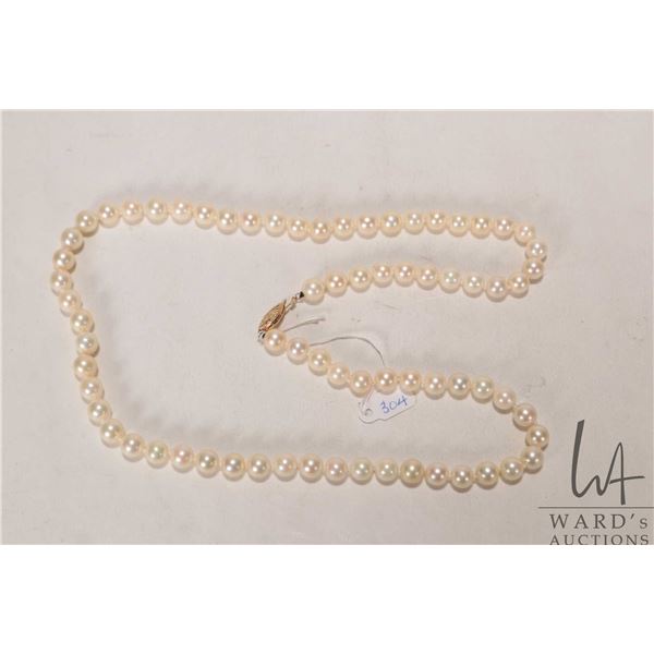 Genuine strand of saltwater culture Akoya pearls, set with 14kt yellow gold clasp. Retail replacemen