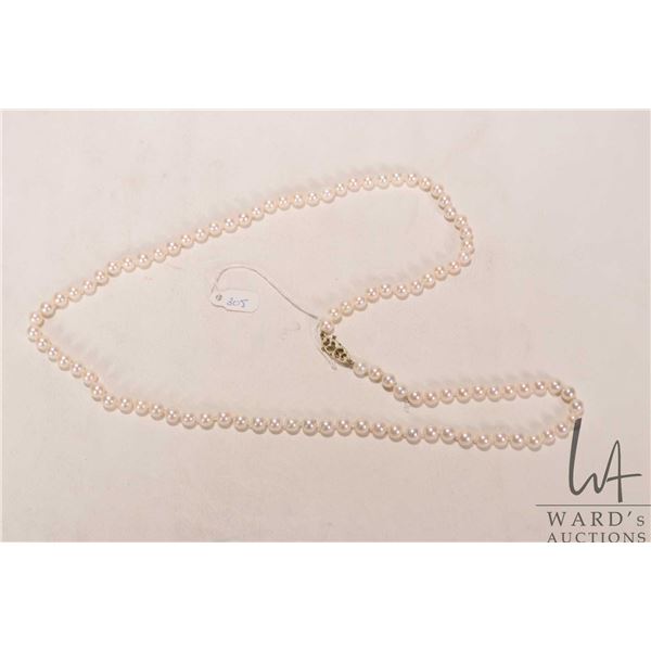 Genuine strand of saltwater cultured Akoya pearls, set with 14kt yellow gold clasp. Retail replaceme