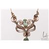 Image 2 : Antique lavaliere set with seed pearls and green peridot like gemstones attached to 10kt yellow gold