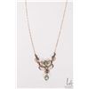 Image 4 : Antique lavaliere set with seed pearls and green peridot like gemstones attached to 10kt yellow gold