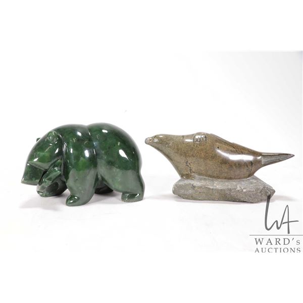 Two Inuit carved animals including jade bear with fish 5" in length, and a signed soapstone seal wit