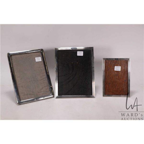 Three vintage sterling silver picture frames including two 8" X 5" and a 6" X 4"