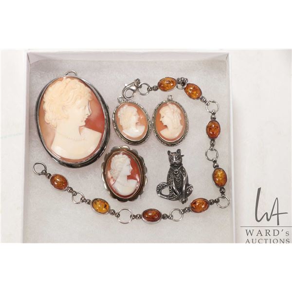 Selection of carved cameo jewellery including pendants, brooch and earrings sans hooks and a silver 