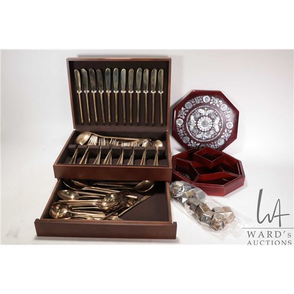 Canteen containing a selection of brass flatware, settings for twelve of dinner forks, dinner knifes