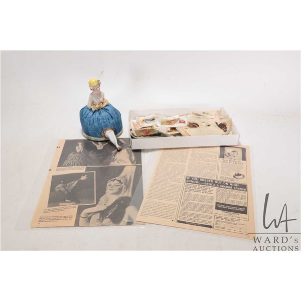Vintage porcelain pin cushion doll and a selection of antique silk cigarette flags including animals