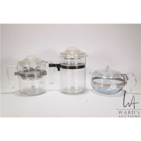 Two vintage Pyrex coffee perculators and a Pyrex tea pot