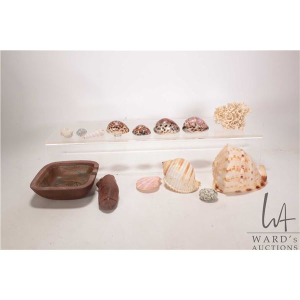 Tray lot of collectibles including red granite native American hand tool, a earthen clay trilobyte a