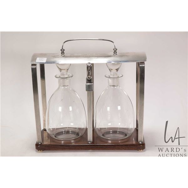 Vintage silver plate tantalus with two drinks decanters, note: has engraved dedication