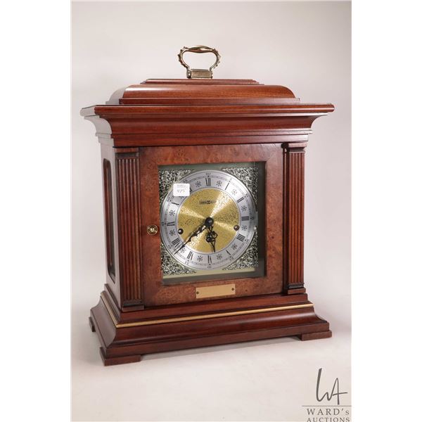 Wood cased chiming mantle clock by Howard Miller, not working at time of cataloguing, won't stay run