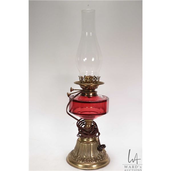 Antique oil map with cranberry glass font and brass base with electric Young's Special adaptation an