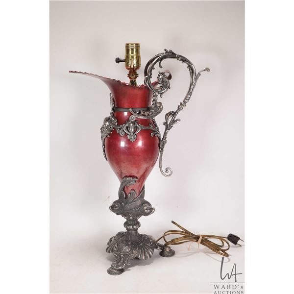 Vintage metal ewer style table lamp with Poseidon mask and fish motif base, 19" in height