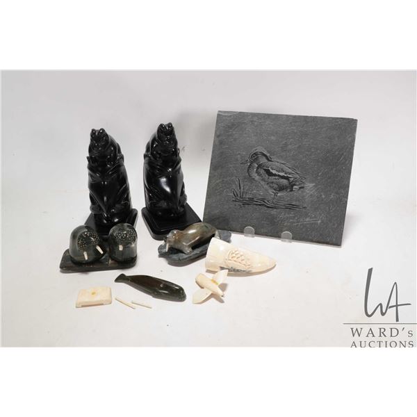 Tray lot of Inuit collectibles including stone carvings, scrimshaw tooth, etched Abraham Lewis duck 