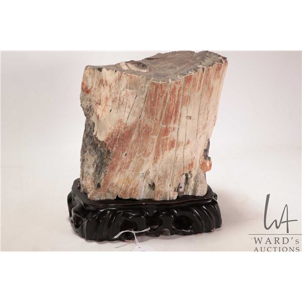 A piece of Chinese petrified wood on custom wooden display stand, 10" in height