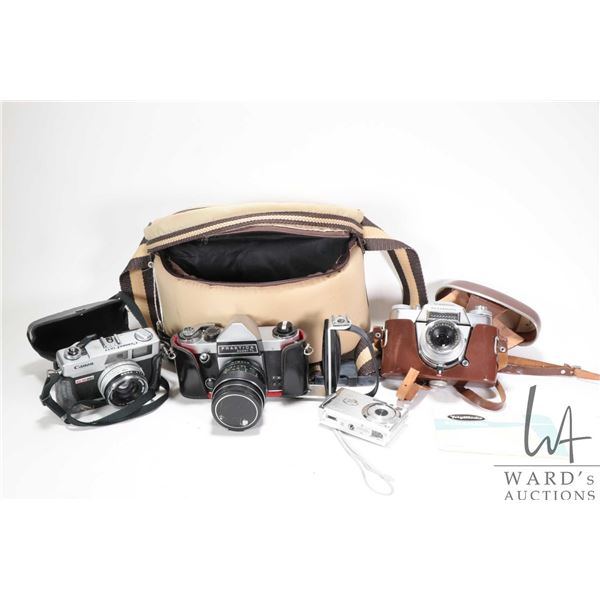 Three cameras including Canonet QL17 G-3 film camera, Praktica Super TL film camera and Voigtlander 