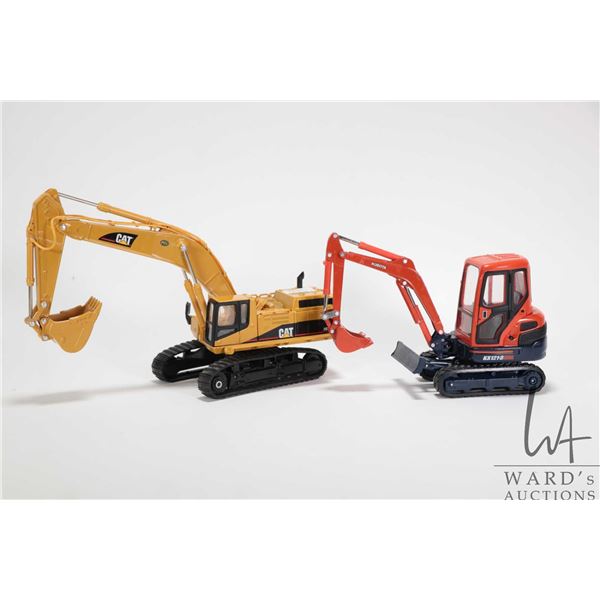 Two die cast models including a Norscot 1:32 scale Caterpillar excavator and a 1:24 scale Kubota min