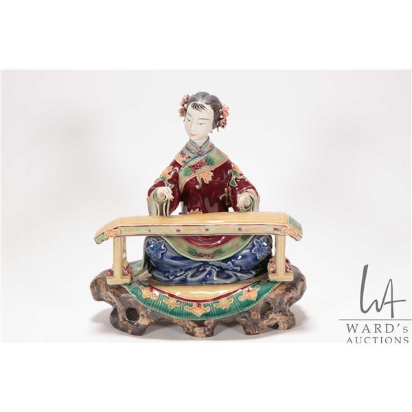 Chinese Wucai porcelain figure of a noble woman playing a Chinese zither, 7 1/2" in height