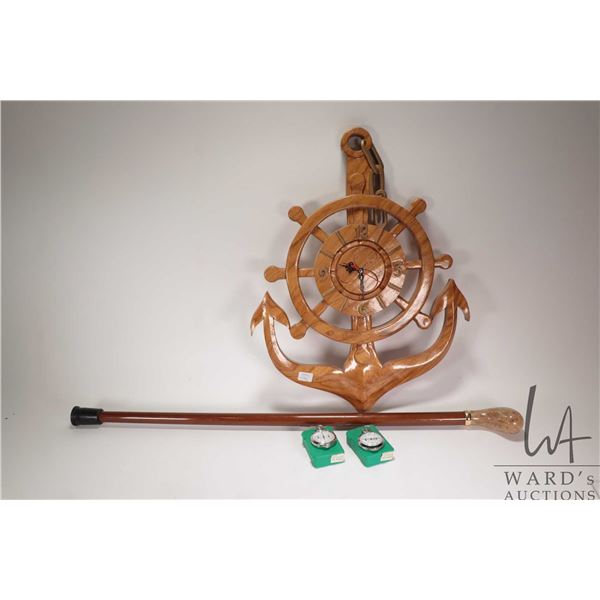 Hand carved wooden anchor motif wall clock, two map measuring devices and a walking cane