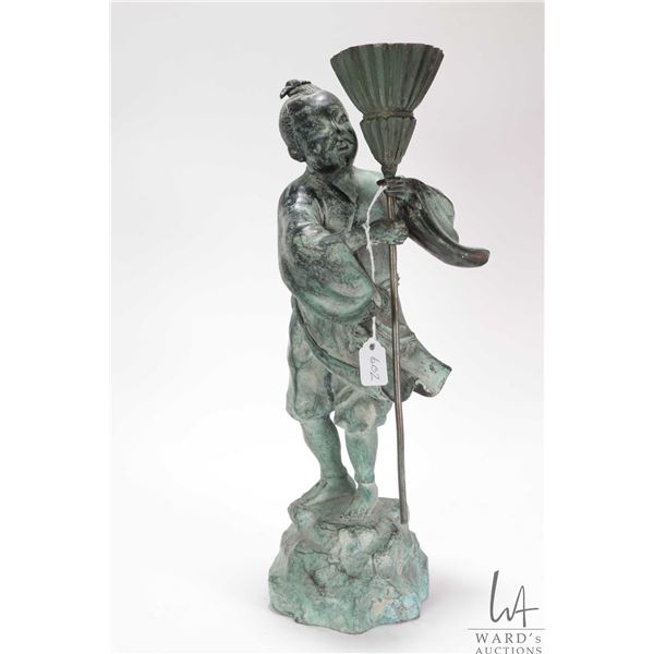Patinated bronze statue of an Asian man holding a broom, 13 1/2" in height