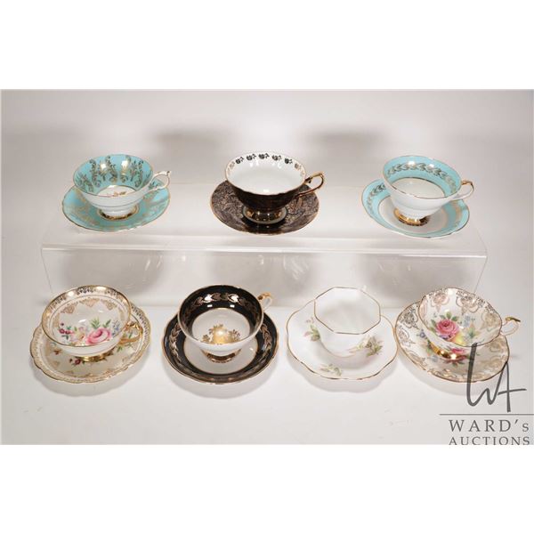 Seven collectible china teacups and saucers including Elizabethan, Staffordshire and Paragon