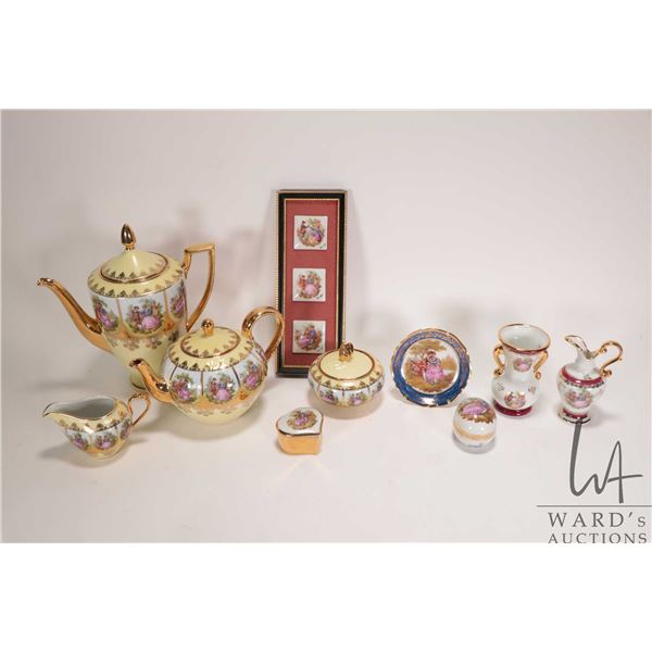 West German tea set with coffee pot, teapot, cream and lidded sugar, all with painted lovestory pane