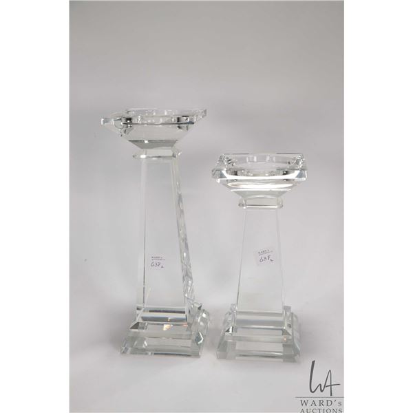 Two graduated crystal candlesticks including 11" and 9"