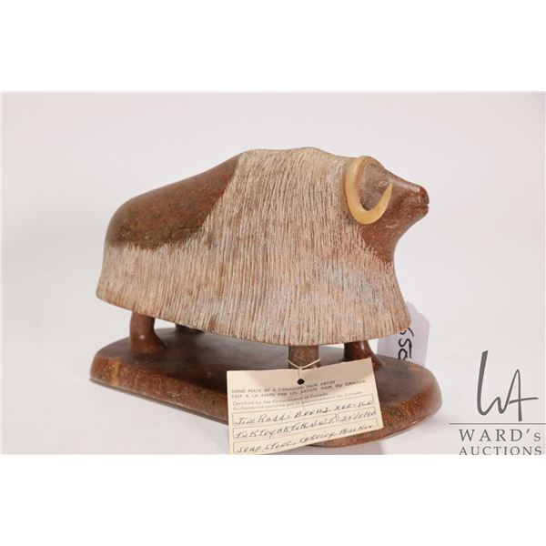 Jim Raddi, Tuktoyaktuk N.W.T. Inuit soapstone carved muskox, dated 25/8/90, retains original Canada 