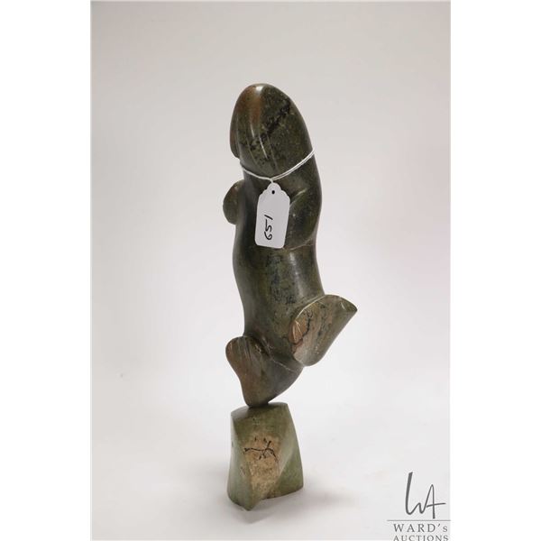 Inuit hand carved green soaptone dancing walrus, on green soapstone plinth, no artist signature seen