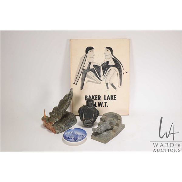 Selection of Inuit soapstone carvings including Eskimo fisherman and igloo fishing hole, signed by a