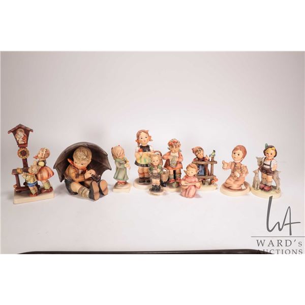Selectin of vintage Hummel figurines including Sign of Spring, Little Goat Herder, Sister, large umb
