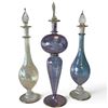 Image 1 : Set of 3 Art Glass Perfume Bottles with Stoppers, Gold Accents, Blue Purple & Clear, 13 In. Tall