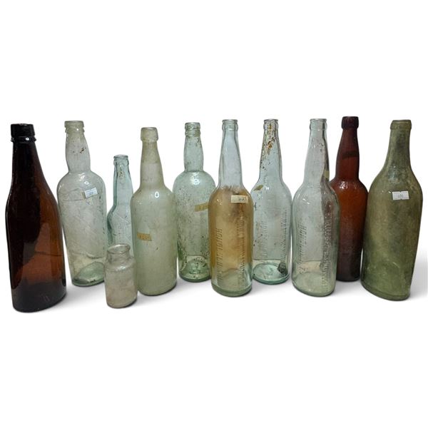 Group of 11 Embossed Glass Bottles, Honolulu Brewing & Malting Co. Ltd., T.H.