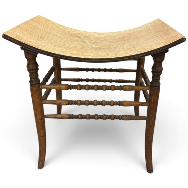 Oak-Toned Wood Saddle-Seat Stool with Turned Legs & Spindle Stretchers (19 x 15 x 18 in.)
