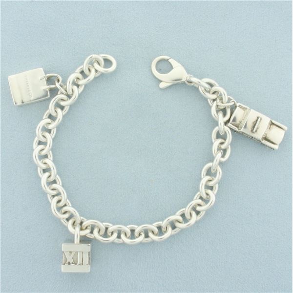 Tiffany and Co. Vintage Charm Bracelet with Taxi, Shopping Bag, Atlas Cube Charms