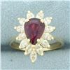 Image 1 : Pear Cut Ruby and Diamond Halo Ring in 14k Yellow Gold
