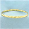 Image 1 : Hinged Twisting Design Bangle Bracelet in 14k Yellow Gold