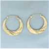 Image 1 : Diamond Cut Twisting Hoop Earrings in 14k Yellow Gold