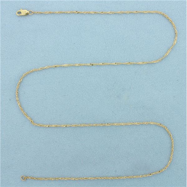 18 Inch Twisting Curb Link Chain Necklace in 14k Yellow Gold