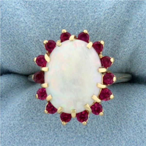 Opal and Ruby Halo Ring in 14k Yellow Gold