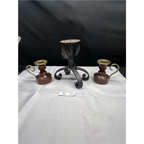 A Cast Iron Candle Stick Plus Matching Candle Holders