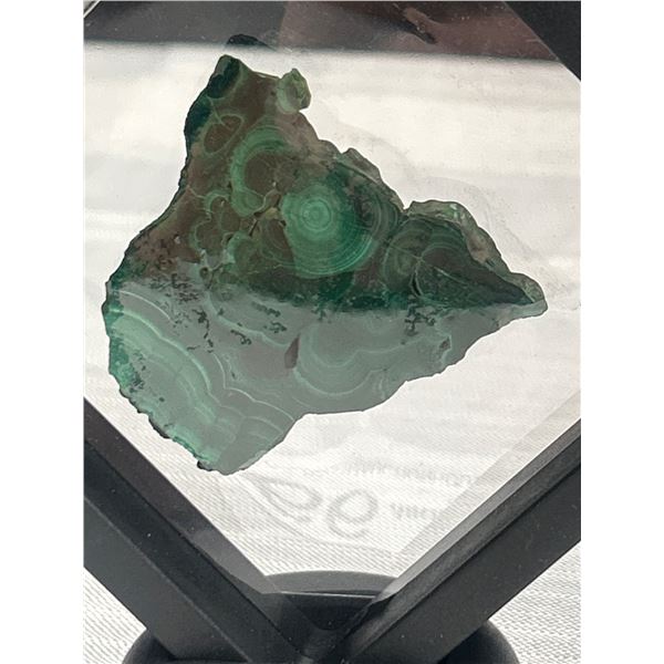 A Natural Green Malachite Stone in Display Stand