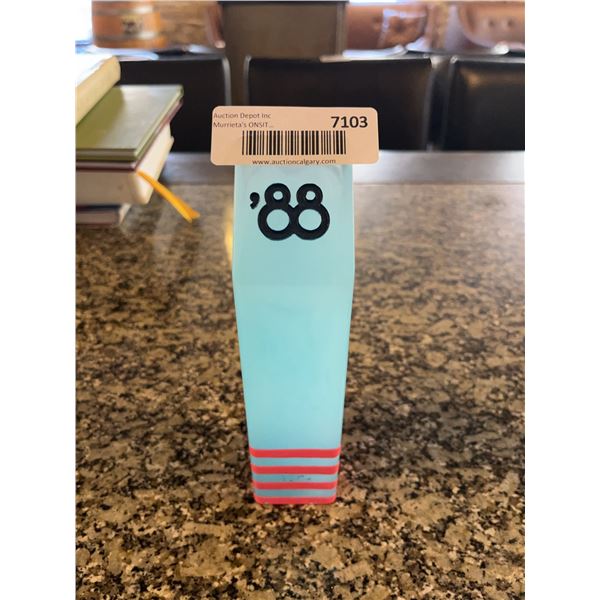 Turquoise and Red Decorative Block with '88' Motif