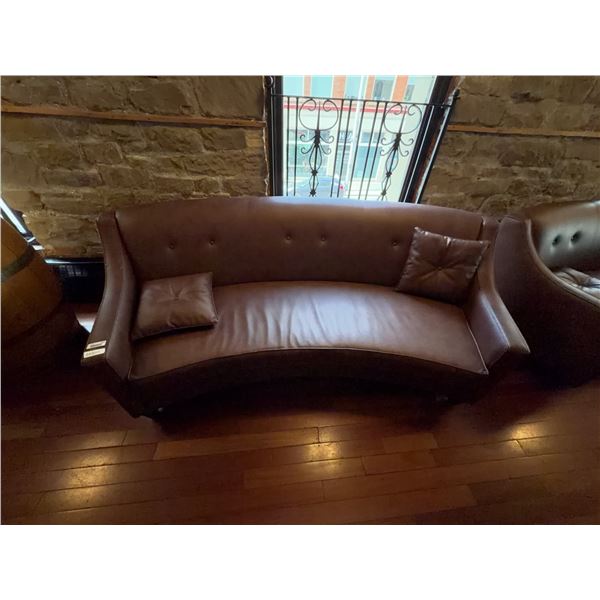 Curved Brown Faux Leather Sofa with Pillows