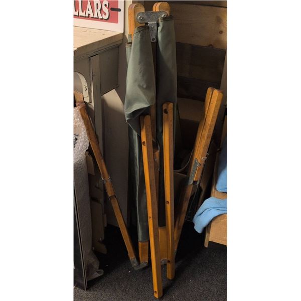 Military Cot, Blue Sweater, Pants, Military Cap and Assorted Hangers