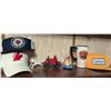 Image 1 : Firefighter Hats, Toy Fire Wagon, Mug, and Figurine Lot
