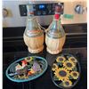Image 1 : Cast Iron Pot Holders and Il Ruffino Vintage Wine Bottles